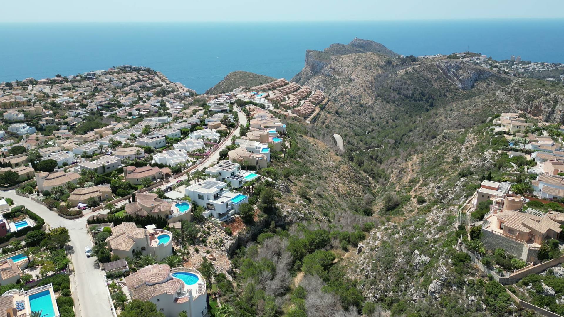 The villa on the front row above the Garsiva gorge, the coast and the Penon de Ifach beyond