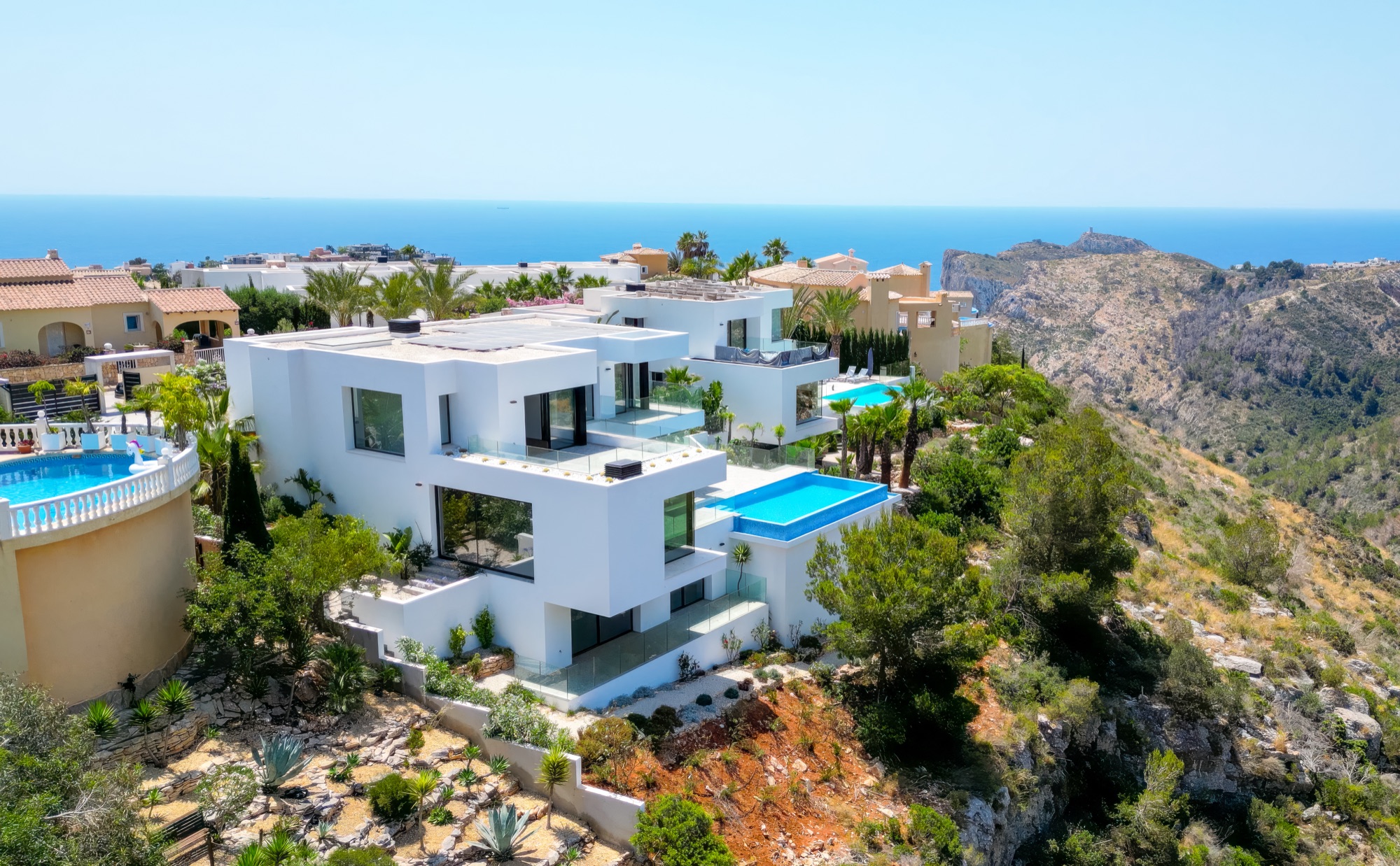 The villa on the cliff edge above the Garsiva gorge, seen from the sea side