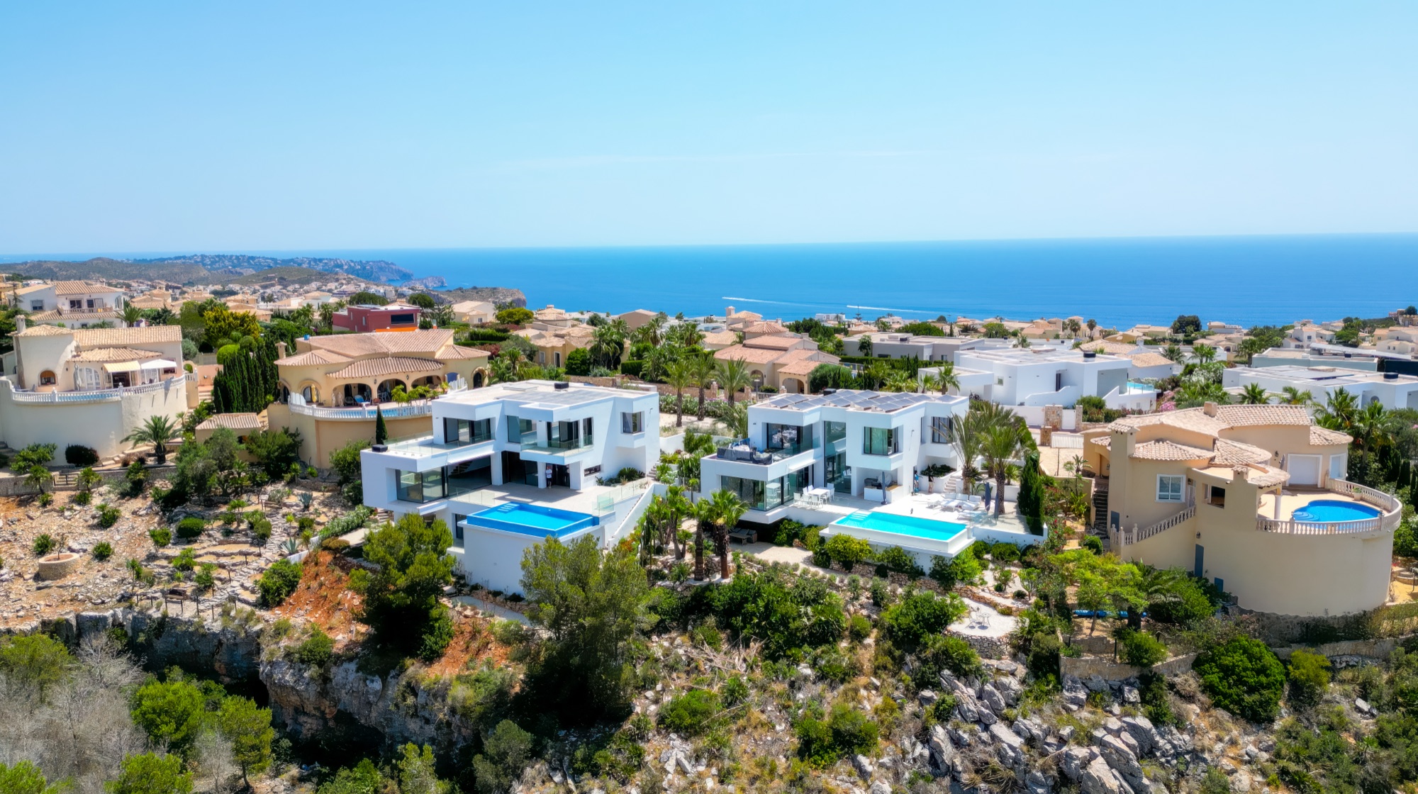 The Magnolias enclave on the cliff edge of Cumbre del Sol, the open sea beyond