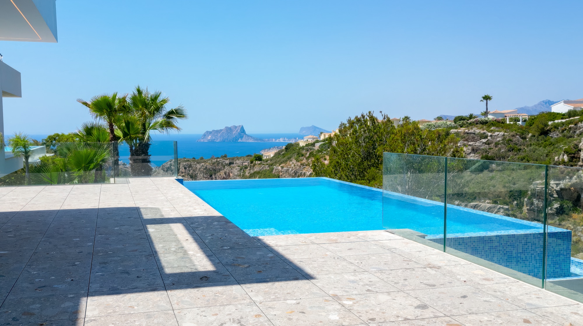 The infinity pool from above, the Penon de Ifach on the horizon